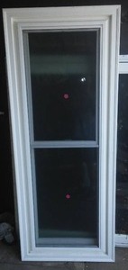 Double hung window, wavy privacy glass.