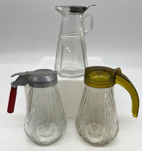 lot 126 image: Trio of Vintage Syrup Bottles