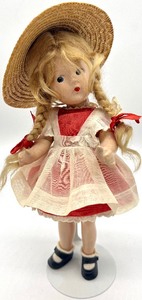 lot 103 image: Vintage Madame Alexander MCGUFFEY ANA Doll with Rustic Cabinet