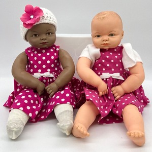 lot 141 image: Pair of Miss Peep Dolls - Fuchsia Dresses