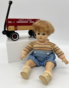 lot 197 image: Vintage Madame Alexander BUTCH Doll and Toy Radio Flyer