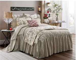 lot 23 image: Ticking Stripe Ruffled Bedspread - King Size