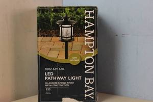 lot 20 image: NEW - Hampton Bay Birmingham 3-Watt Oil Rubbed Bronze Outdoor Integrated LED Landscape Path Light with Crackled Shade 6940500318165 MSRP $44.97
