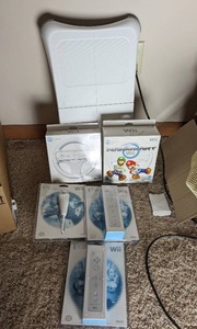 lot 368 image: Wii Remotes and Board