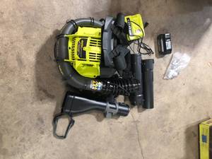 lot 33 image: RYOBI 40V HP Brushless Whisper Series 165 MPH 730 CFM Cordless Battery Backpack Blower with (2) 6.0 Ah Batteries and Charger  Customer Returns See Pictures