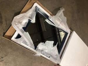 lot 40 image: Home Decorators Collection Sturgess 27 in. W x 36 in. H Framed Rectangular Beveled Edge Bathroom Vanity Mirror in Navy Blue  Customer Returns See Pictures