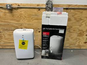 lot 12 image: LG 6,000 BTU (DOE) 115-Volt Portable Air Conditioner LP0621WSR Cools 250 Sq. Ft. with Dehumidifier Function and LCD Remote