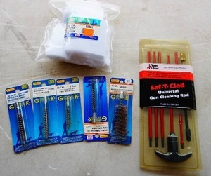 lot 11 image: (5) Outers Gun Cleaning Brush (1) Gun Cleaning Patches (1) Safety C-Lad Rod