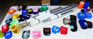 lot 59 image: New Can and Bottle Huggers Koozies and Curtain Rods