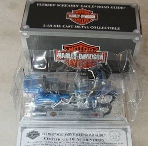 lot 115 image: Harley-Davidson 118 scale  2000 Harley-Davidson FXDL Dyna Low Rider - Teal AvonMaisto w box & COA