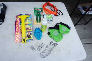 lot 137 image: For the Dog...Nail Trimmer, Doggy Wash, Insulated Paws, Furminator Shampoo and Conditioner, Zoom Groom, Collars,  Whistle and Biffy Bag