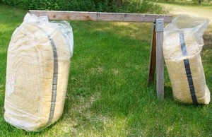 lot 147 image: (2) 15 x 40 foot Insulation Rolls and Saw Horse