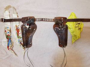 lot 2 image: Very early Roy Rogers Double Cap Gun & Holster Set with 2 Jeweled cap guns by Geo Schmidt in excellent condition