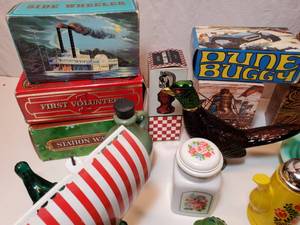 lot 66 image: 10 Avon Collector Bottles in boxes (these boxes were never opened), and 21 Avon bottles & items without boxes--many still with original contents.