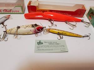 lot 154 image: New in Boxes--Wooden Creek Chub Injured Minnow, Storm Big Mac, Wood Heddon SurfaceCobra and a Rapala.