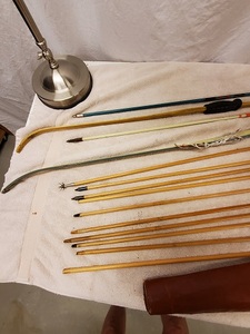 lot 97A image: Pair of very old fiberglass bows and cedar and fiberglas arrows, some with 4-fletches