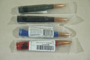 lot 31 image: 4 Lucky Shot 50 Cal Bottle Openers