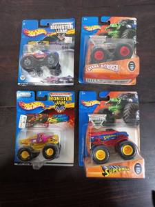 lot 55 image: Four Packs Of Hot Wheels Monster Trucks
