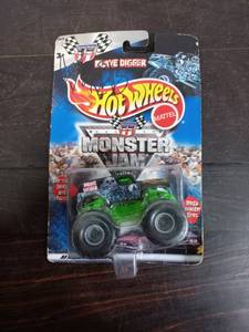 lot 56 image: Signed Pack Of Hot Wheels Monster Jam Grave Digger