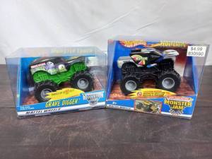 lot 63 image: Two Packs Of Friction Powered Hot Wheels Monster Trucks