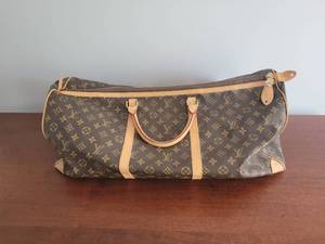 lot 25 image: Louis Vuitton Duffle Bag