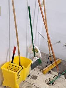 lot 1099 image: Lot of (5) Cleaning Supplies - Rubbermaid Commercial Rolling Mop Bucket with Mop, Push Broom, Broom with Dust Pan, Floor Squeegee