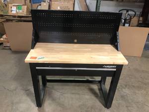 lot 1 image: Husky 4 ft. Solid Wood Top Workbench in Black with Pegboard and 1 Drawer  Customer Returns See Pictures