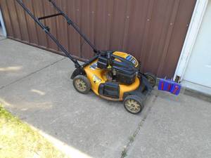 Cub Cadet push lawn mower. Runs real good. Tested & works. As shown.