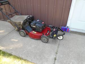 Toro self propelled personal pace mower with bagger & dethatcher. Tested & works. As shown.