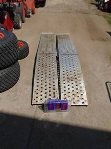 Pair of aluminum folding ramps. Approx 7. Nice shape. As shown.