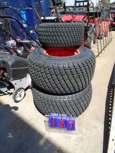 2 rear & 1 front Kabot wheels & tires. Looks like they could fit a big Craftsman. As shown.