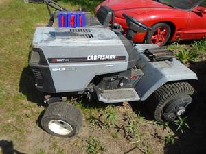 Craftsman GT 18 hp twin Kohler twin 6 speed with wheel weights. For parts or repair. As shown.