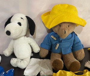lot 149 image: Snoopy and Paddington Bear with a Variety of Clothing