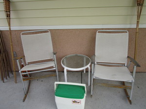 lot 144 image: Patio Rockers, Table, Tiki Torches