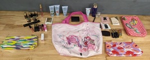 lot 110 image: ALL NEW Make Up-Bags with Make-Up Accessories and Perfume Samples Estee Lauder, Michael Kors, Narciso Rodriguez, Etc. E