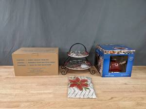 lot 143 image: New Set of Two Holiday Decorative Plates with Stand, Disney Holiday Train Set, and Crofton Tea Kettle  K