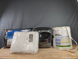 lot 165 image: JC Penney Queen Mattress Pad, Claritin Ultimate Allergen Barrier Standard Pillow, BlackGrey Comforter, and Room Essentials Queen Foam Mattress Topper K