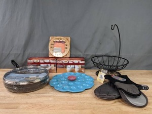 lot 151 image: 11 Frying Pan with Lid, Egg PlateTray, Crofton Trivet Set, Gravy Boat, Cream & Sugar Set, Fruit Basket with Banana Hook, Oven Mitts K