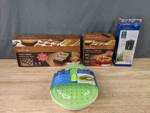 lot 183 image: NEW Crofton Taco Rack, Tortilla Pan Set, Cutlery Set, and Vegetable Steamer K