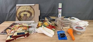 lot 200 image: NEW Home Essentials Dishtowels, Oven Mits, Orange Squeezer, Vinyl Top Liner, Wine Stopper, Rug & More K