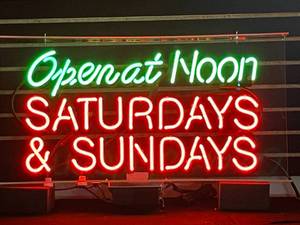 lot 47 image: Open at Noon Saturdays & Sundays neon sign