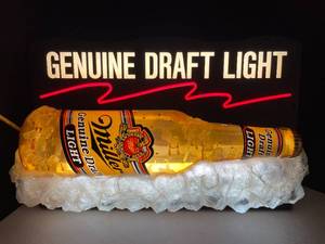 lot 81 image: Miller Genuine Draft Light fluorescent-lit bottle with ice cubes