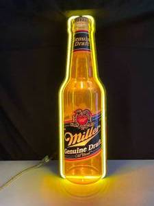 lot 82 image: Miller Genuine Draft light-up bottle with neon border