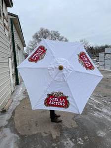 lot 144 image: Stella Artois patio  market umbrella
