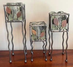 lot 85 image: Decorative Candle Holders and a Metal Vase