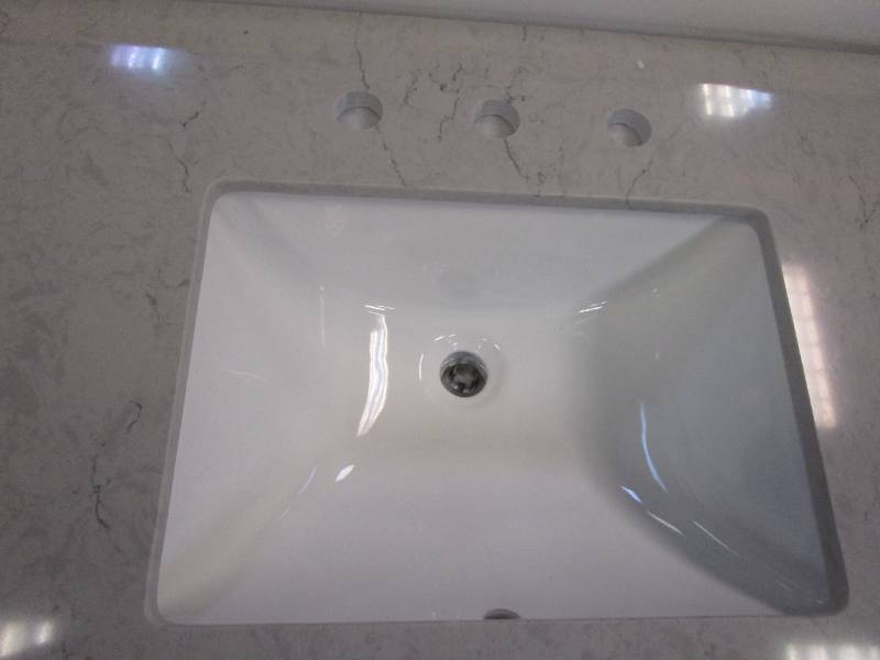 lot 372 image: 43 in x 22 in 3 Hole Engineered Stone Vanity Top with Backsplash (CHIPPED BACK RIGHT CORNER)