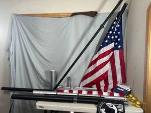 lot 80 image: Flag Pole Parts, Flags, Bases, and More.