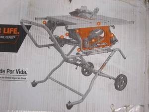 lot 12 image: RIDGID 15 Amp 10 in. Portable Corded Pro Jobsite Table Saw with Stand (NEW IN BOX)