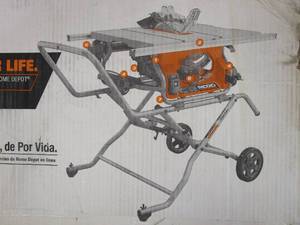 lot 13 image: RIDGID 15 Amp 10 in. Portable Corded Pro Jobsite Table Saw with Stand (NEW IN BOX)