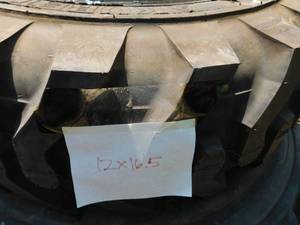 lot 38 image: 1 - AKURET Pneumatic Skid Steer Tire on Rim
